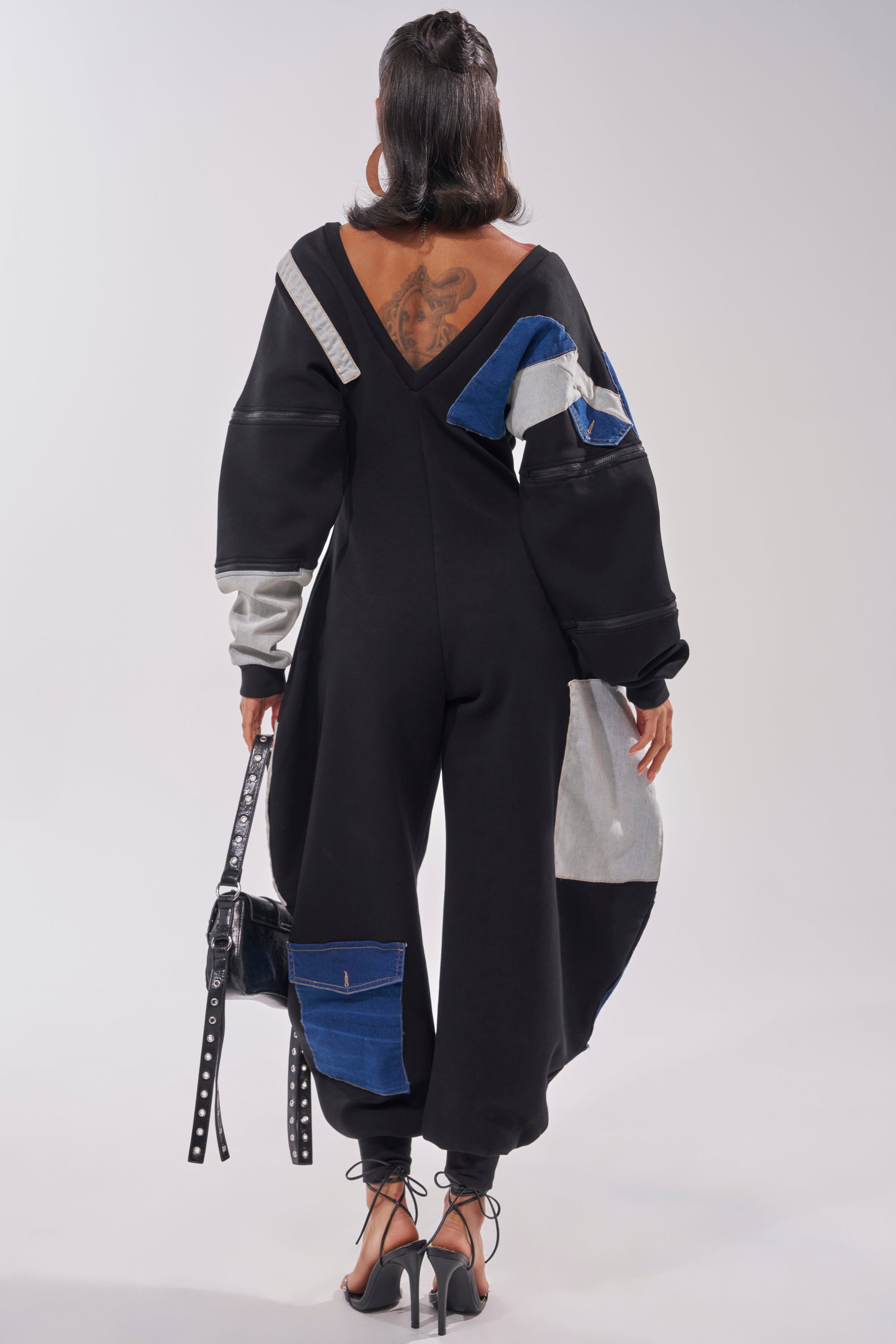 COMFY COZY SWEATSHIRT JUMPSUIT IN PATCHWORK DENIM IN BLACK